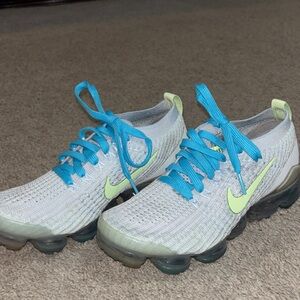 Nike Flyknit Sneakers with Blue and Lime Accents